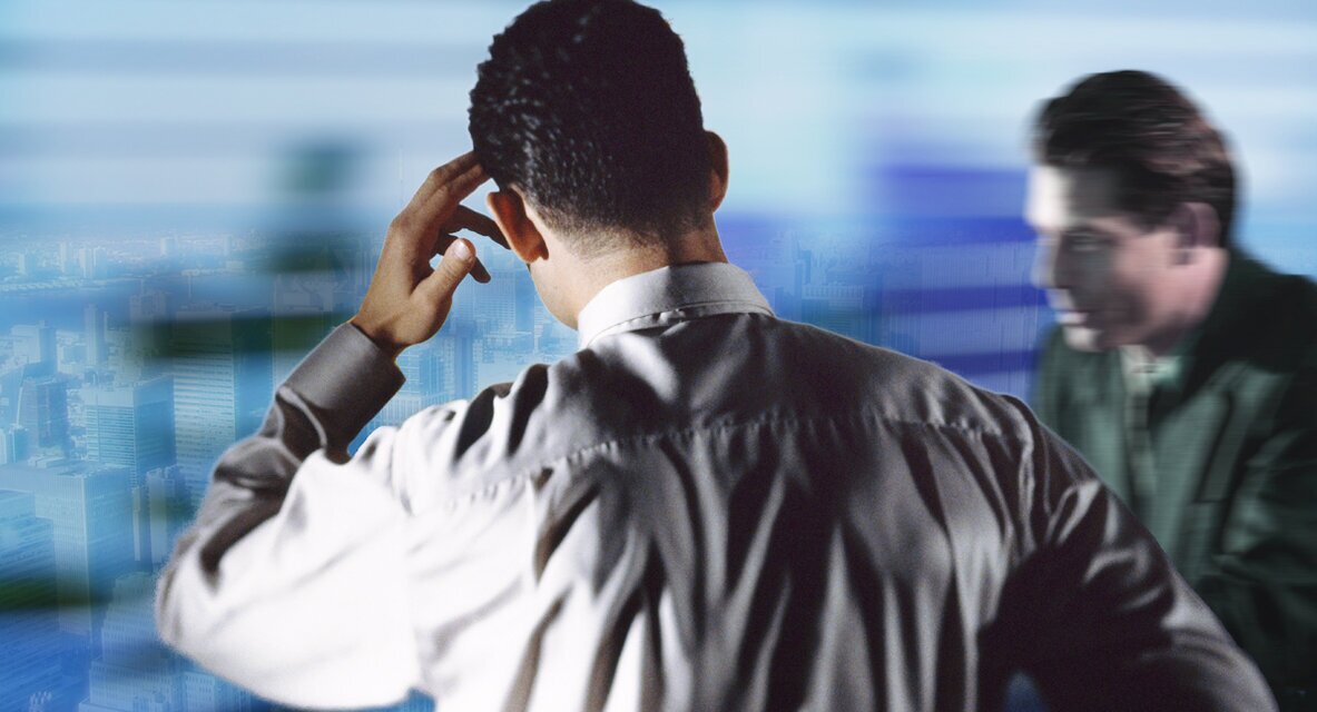 Finding ideas Photo: Two men, one of whom is thinking, the other is thinking from behind with a hand on his forehead.<br />©Ingram, ©memephoto